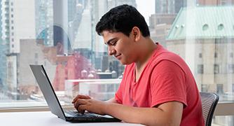 Image of student on a laptop