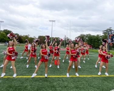 Image of the Marist Dance team performing during a football game at Tenney Stadium.